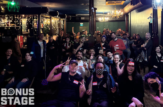 Bonus Stage - April image of attendees watching talks at bonus stage